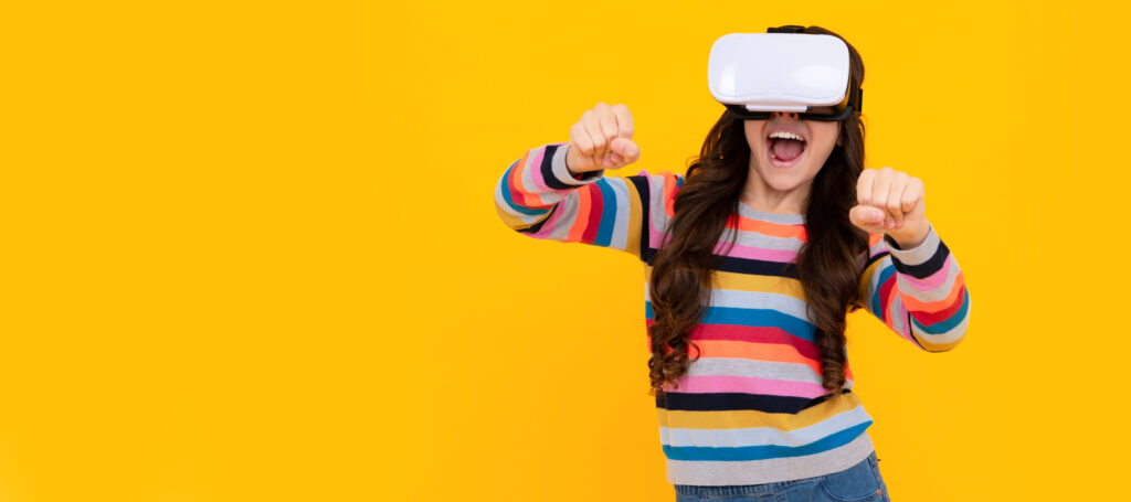 Amazed teenager. Virtual gadgets for kids, free time and study. Teenage girl uses vr glasses. Banner of child girl with virtual reality vr headset, studio portrait with copy space